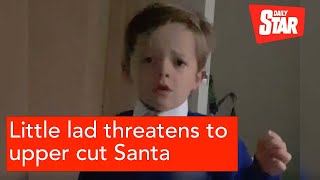 Little lad threatens to upper cut Santa