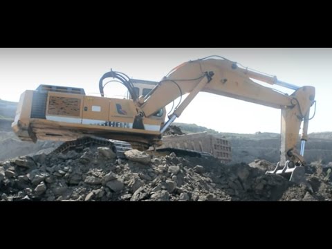 Liebherr 974 Excavator Loading Trucks