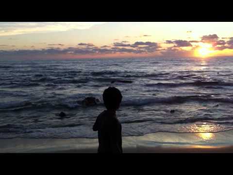 Sidhu collects sand in the beach