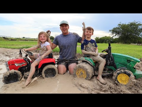 Playing in the mud and pulling real tractor out of the mud | Tractors for kids
