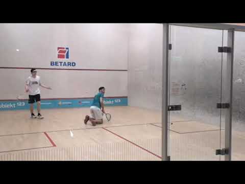 SQUASH. He gets the winner while on his knees!