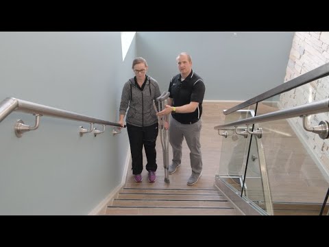 Crutch use: Ascending stairs with a handrail
