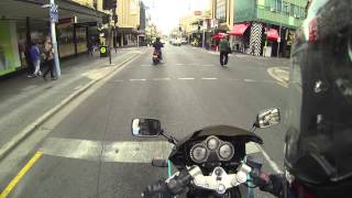 Scooter chick runs a red light! Almost hits a pedestrian! (Close call!)