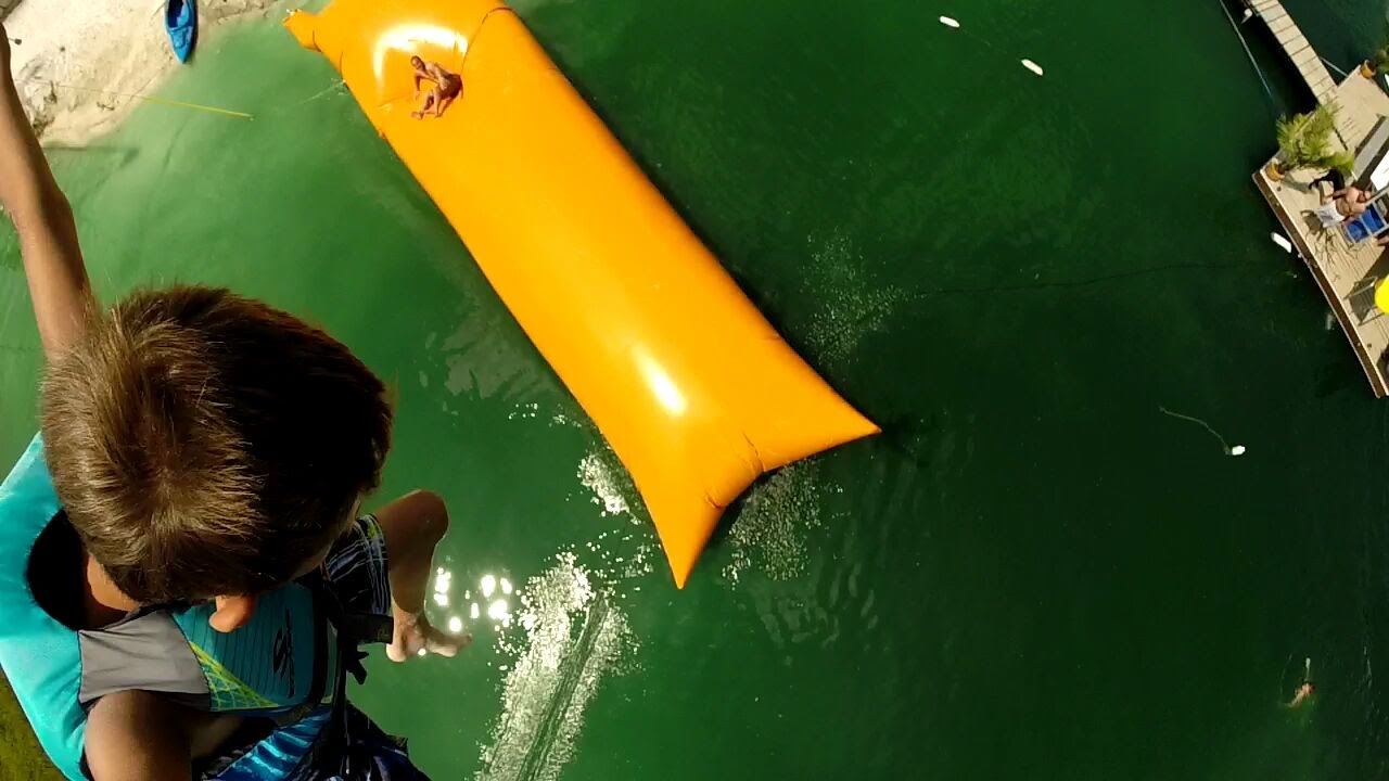 Campers launching off Water Blob® into lake - featured video thumbnail