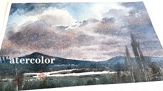 How to paint a vast sky and land with watercolor