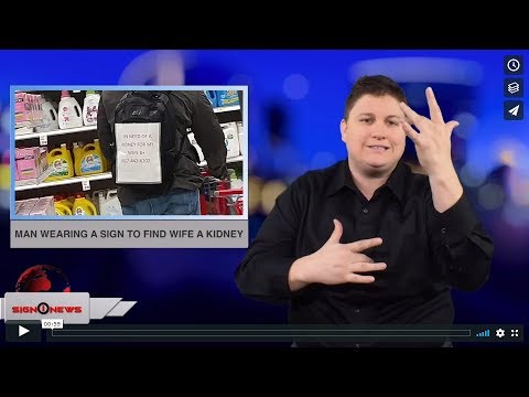 Man wearing a sign to find wife a kidney (ASL - 12.28.18)