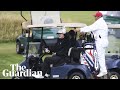 President Trump waves to protesters as he plays golf in Scotland President Trump waves to protesters as he plays golf in Scotland