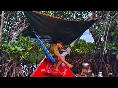 Camping on the river with a small boat, cooking on a floating refrigerator door