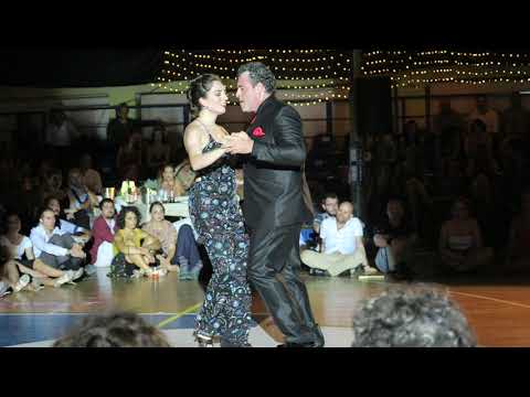  Fabian Salas  and  Lola Diaz  are  dancing  to  a  nontraditional song  at  A los amigos tango festival  in  2019