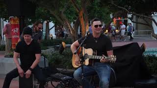 Bryan Malpass singing Die a Happy Man at Disney Springs in September 2018.