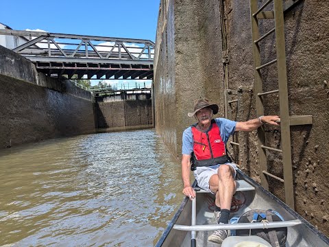 Taking a canoe through Gloucester Lock on the River Severn