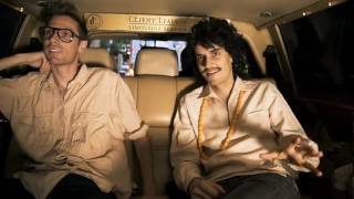 Riding in Client Liaison’s off white limousine