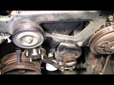 2002 Nissan Xterra VG33E Rebuild Step by Step Part 9 - Upper Bracket Belt Tensioner Removal
