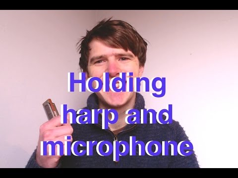 Holding the harmonica and microphone (Harmonica Q&A Live)