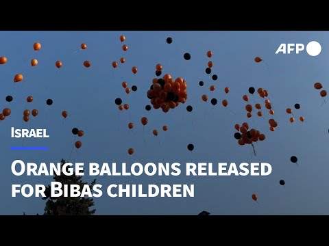 Orange balloons released in Jerusalem in honour of Bibas children | AFP
