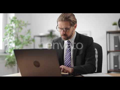 Man Using Laptop for Work at Office | Stock Footage - Envato elements