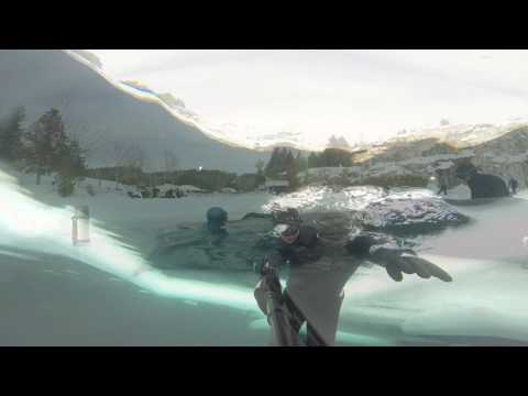 Brave diver plunges deep into frozen lake