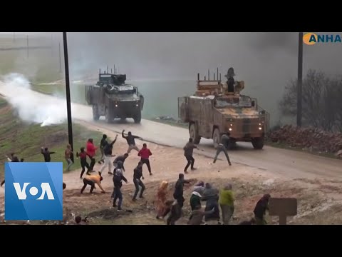 Civilians Throw Rocks at Turkish Military Convoy in Northwestern Syria