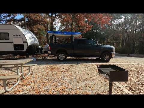 Campsite spot includes a picnic table and a small grill