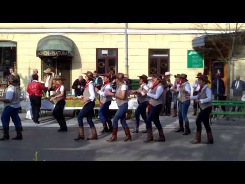 Mix of cowboy-look and polka music dance on Ljubljana open fruit and vegetable market