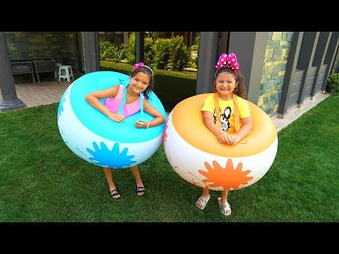 Masal and Öykü playing inflatable balls - fun video