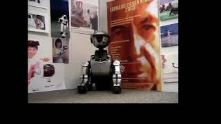 Leo Sony Aibo Robotic Dog Presents Leonard Cohen&#39;s The Great Event with Nikki Olson on Keyboard 2004