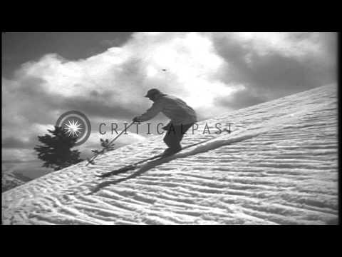 Men sliding downhill and demonstrating the stem turn in the United States. HD Stock Footage