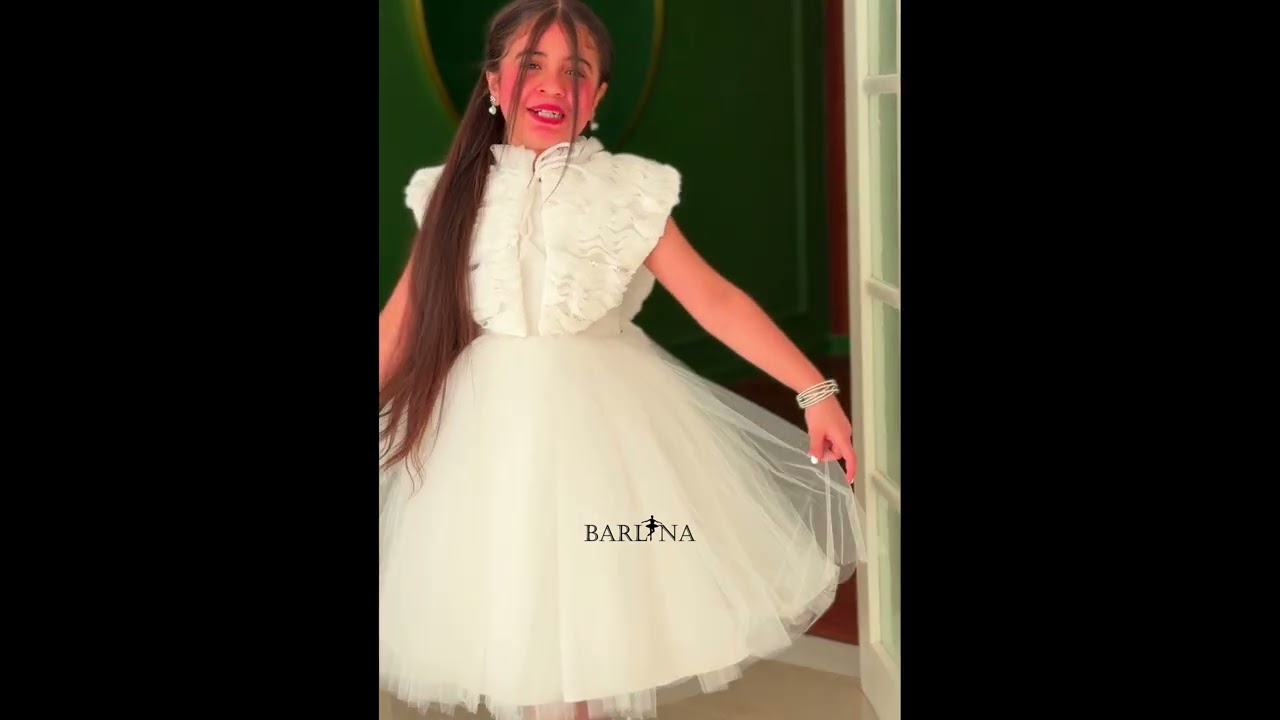 White girl's dress with a large ruffled shoulder - year 1