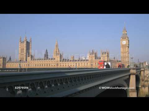 People and traffic passing over Westminster bridge / London, England