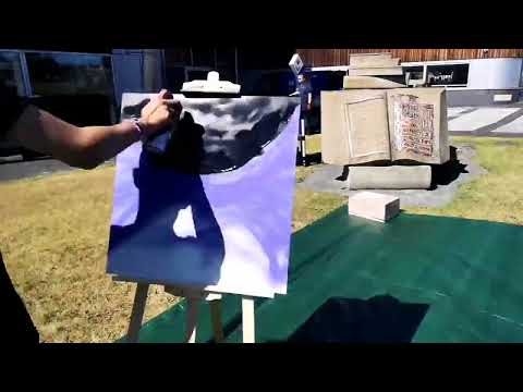 Frank Styles spray paint workshop on the banks of the river wear at Sunderland University