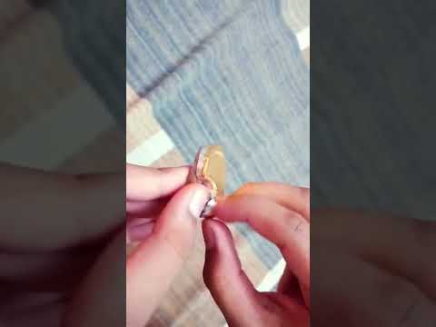 Opening one dollar golden chocolate coin from Canada