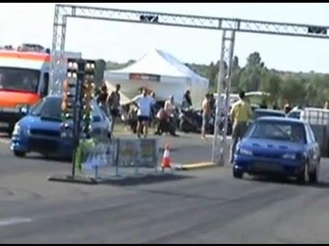 Thumbnail for Subaru Impreza WRX STI Vs. Mazda 323 GT Turbo Drag Race by Mazda, Subaru