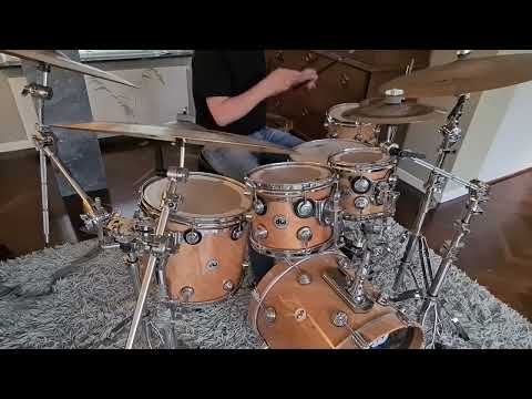 Drumming along a funky groove - DW Collectors twisted birch over maple drums