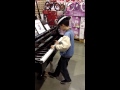 Kid in Costco Plays Piano like a boss 