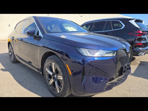 Thumbnail for 2026 BMW iX xDrive60 in Tanzanite Blue Metallic walkaround  by BMW iX