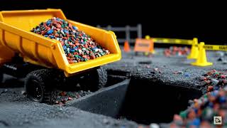 Tiny Titan: Orange RC Dump Truck Faces Landslide in Epic Slow Motion