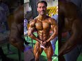 Bodybuilder Chatting And Flexing Backstage