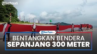 Masyarakat Adat Papua Barat dan Komunitas Motor Bentangkan Bendera Sepanjang 300 meter di Pulau Um