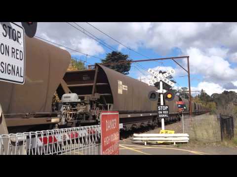 a fright train passing level crossing at Blackheath Blue Mountains NSW Australia