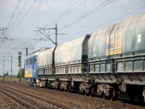 SERVTRANS LOCOMOTIVE 60-0600-1 WITH A HEAVY FREIGHT TRAIN