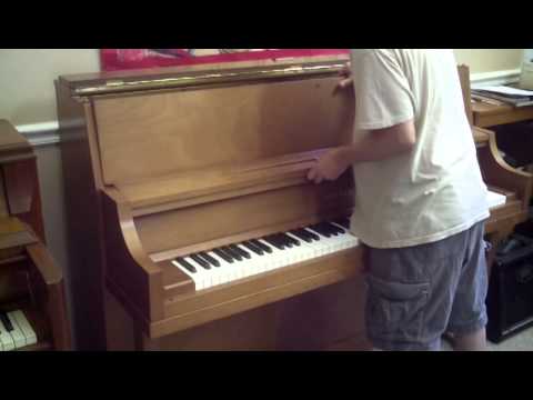 Upright "spinet or console"