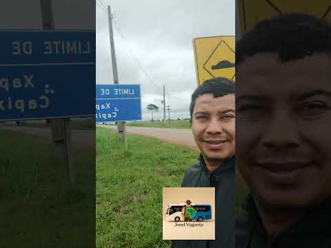 tirando fotos na placa de limite de municípios entre Capixaba e Xapuri no Acre