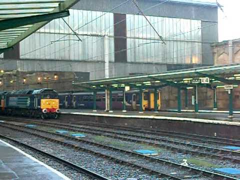 DRS Class 57 57002 57008 at Carlisle with the Chirk logs