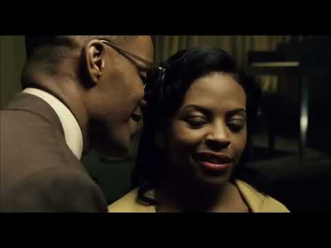Ray (2004) trailer still — Jamie Foxx at the piano, spotlight tight, the band waiting for the downbeat