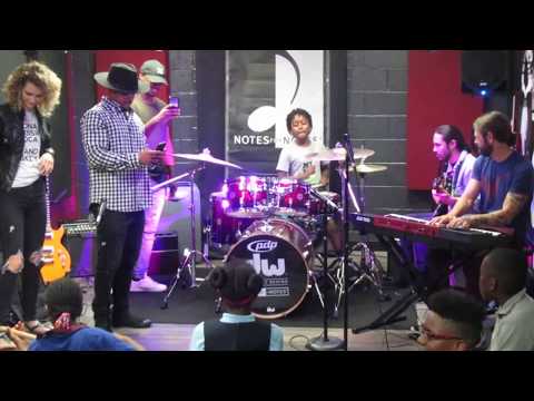 Ayinde drumming with Katy Perry's Band