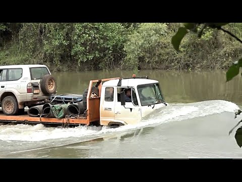 A Tow Truck deep water crossing in crocodile infested waters