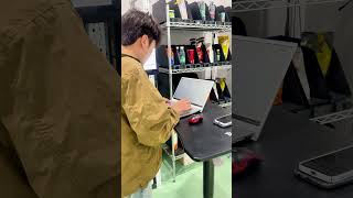 MonolithIoT Operation Maintenance Engineer is Performing Precise Calibration Tests on Smart Shelves