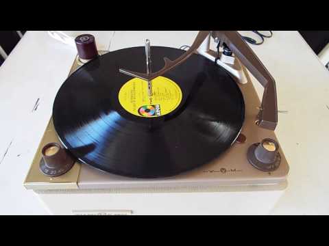 Voice of Music 4 speed automatic record changer playing an LP