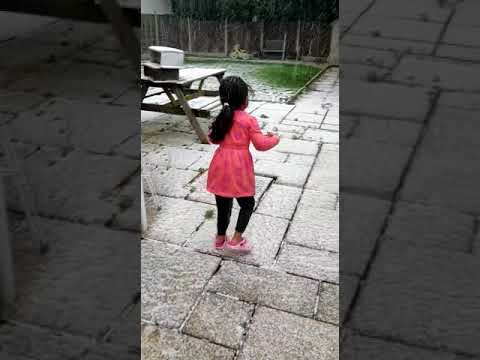 Malini playing with snow in her backyard......