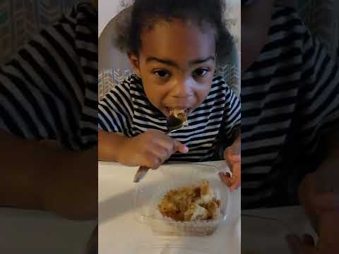 happy toddler with coffee cake
